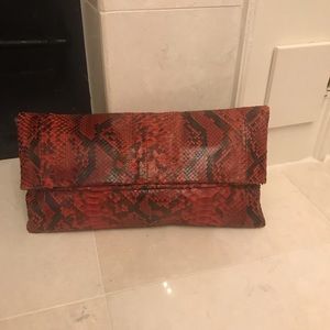Snake skin clutch.